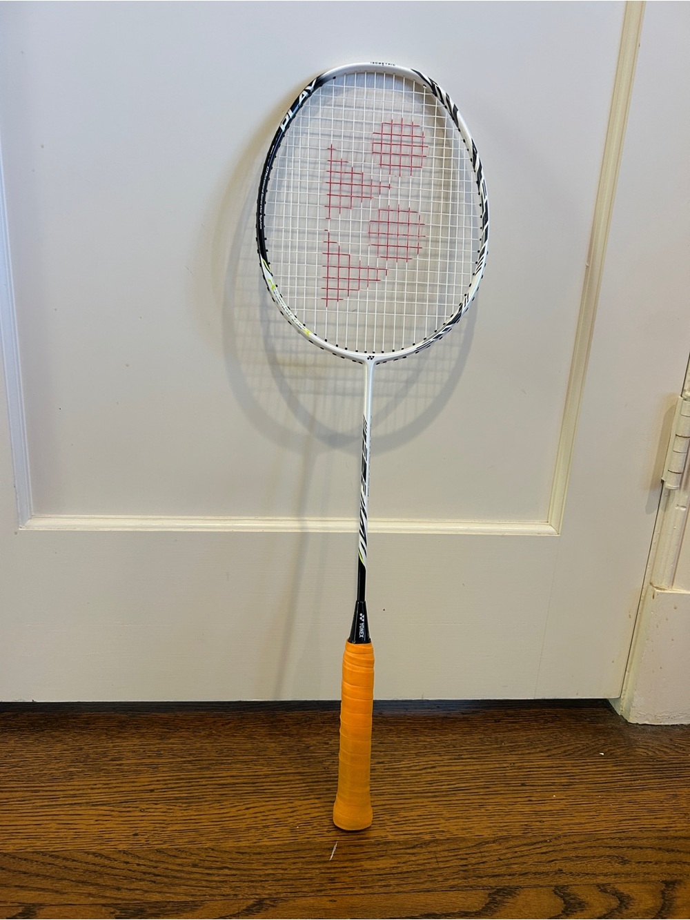 Yonex White Badminton Racket with Orange Grip
